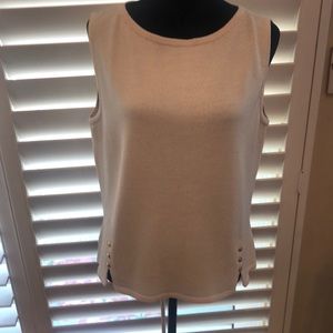 St. John creamy white knit sleeveless top. Nice detail at front hem. Good basic.